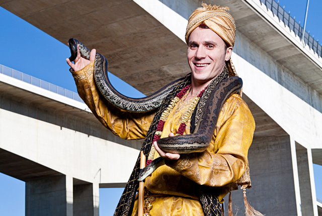 Johnny the Jester dressed as a snake charmer with python